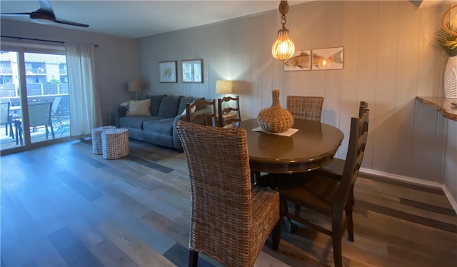 dining space featuring hardwood / wood-style floors and ceiling fan