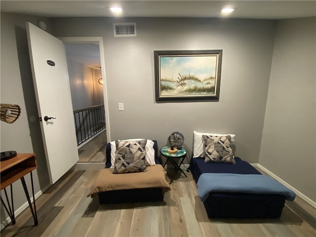 sitting room with hardwood / wood-style floors