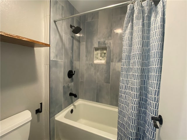 bathroom featuring toilet and shower / bathtub combination with curtain