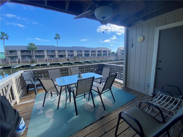 exterior space featuring a water view and ceiling fan