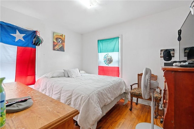 bedroom with wood-type flooring