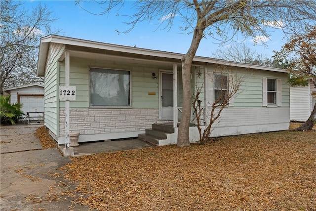 view of front of house with an outbuilding and a garage