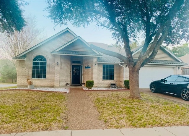 ranch-style house featuring a garage and a front lawn