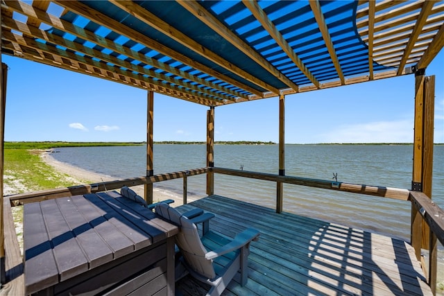 view of dock with a water view and a pergola