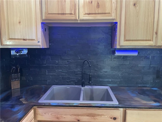 kitchen featuring light brown cabinetry and sink