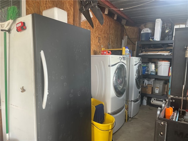 washroom featuring washing machine and dryer