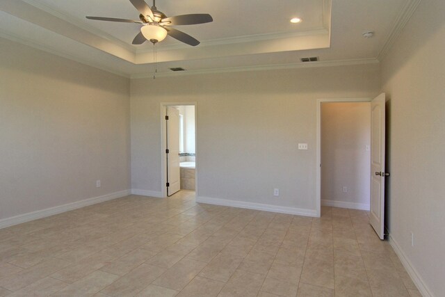 unfurnished room featuring light tile patterned floors, ceiling fan, a raised ceiling, and crown molding