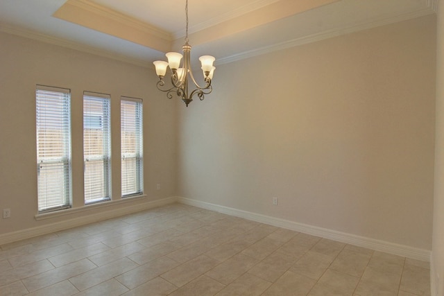 tiled spare room featuring a tray ceiling, a notable chandelier, and ornamental molding