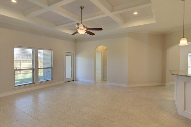 tiled empty room with coffered ceiling, ceiling fan, and beamed ceiling