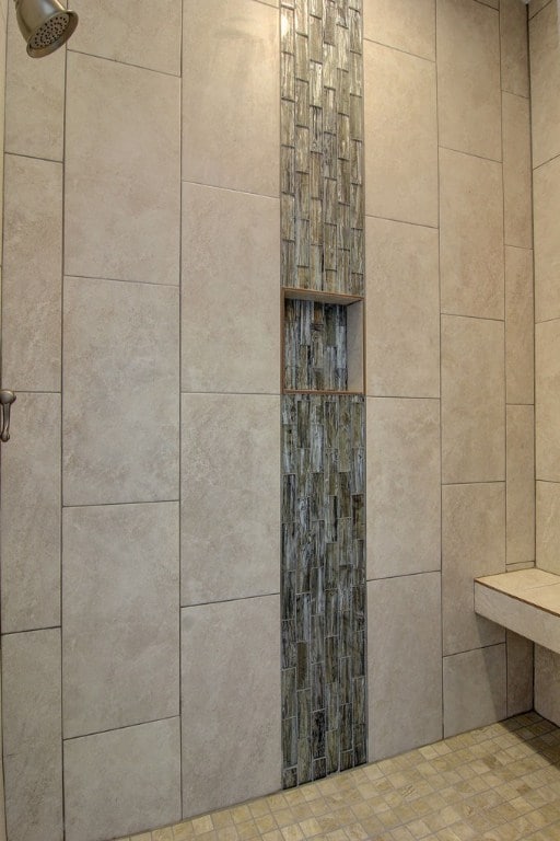 details with a tile shower