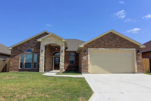 view of front of house with a garage and a front lawn