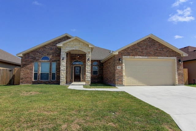 view of front of house with a garage and a front yard