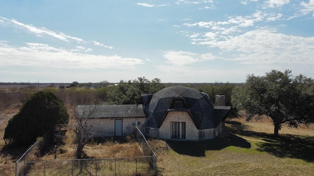 exterior space with a front yard and a rural view