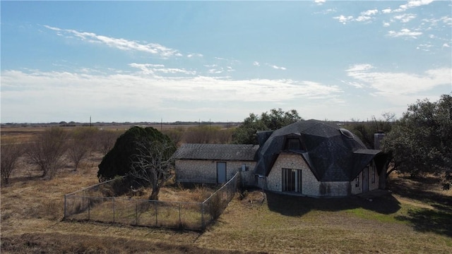 view of outbuilding with a yard and a rural view