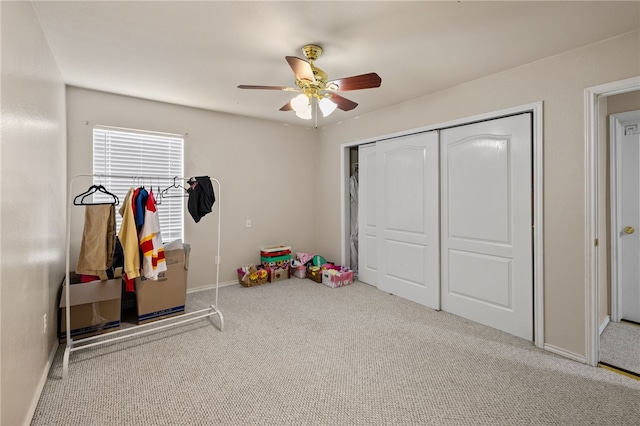 playroom featuring ceiling fan and carpet floors