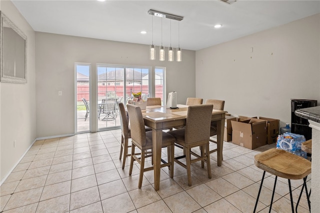 dining area featuring recessed lighting, baseboards, and light tile patterned floors