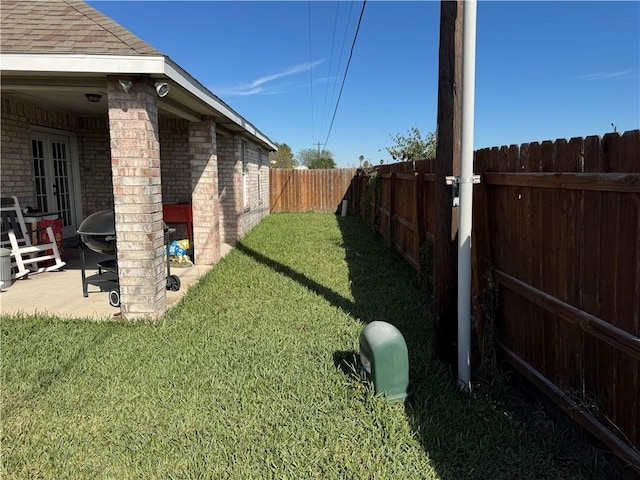 view of yard featuring an outdoor fire pit and a patio area