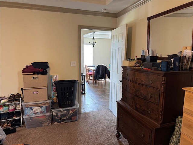 miscellaneous room with crown molding, tile patterned floors, and a chandelier