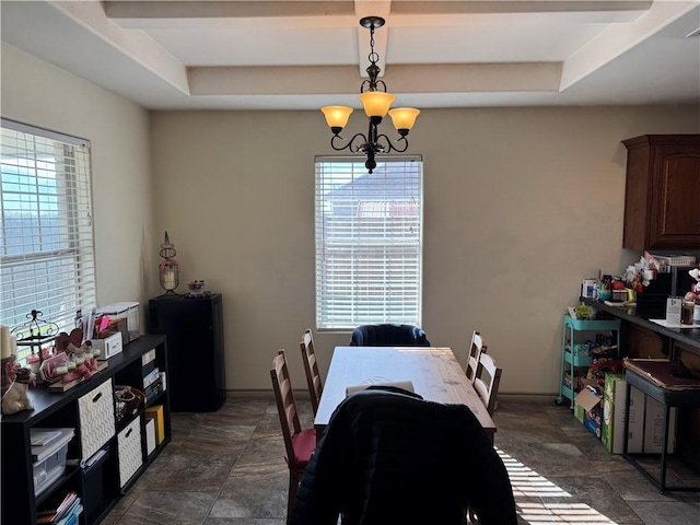 dining space with an inviting chandelier