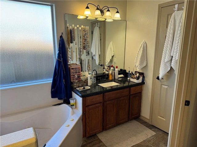 bathroom featuring vanity, tile patterned floors, and a tub to relax in