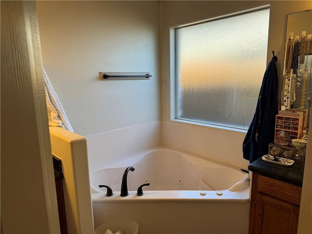 bathroom featuring a tub and vanity