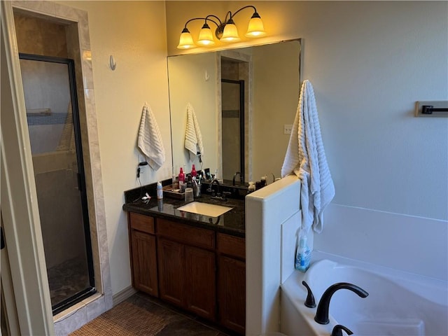 bathroom featuring vanity and separate shower and tub