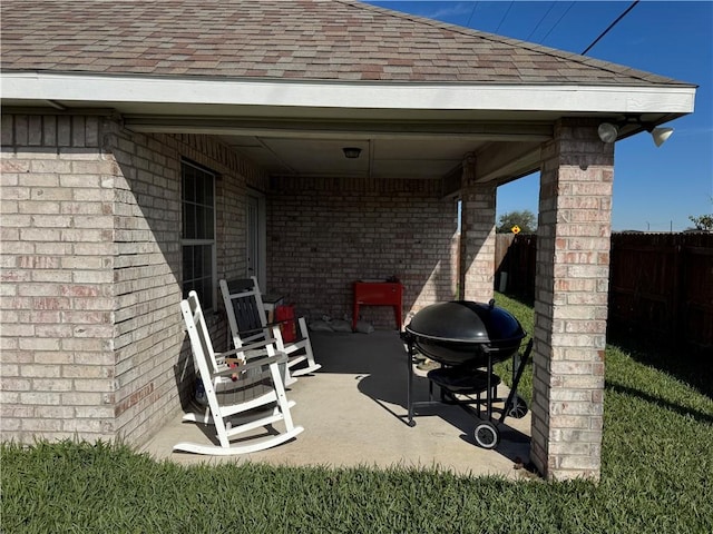 view of patio featuring a grill