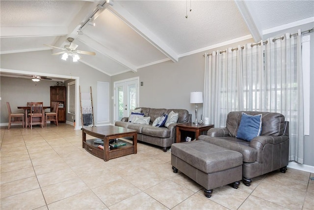 3346 Samoa Dr, Corpus Christi, TX 78418 - living room with ceiling fan, light tile patterned flooring, a textured ceiling, rail lighting, and baseboards