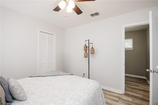 3346 Samoa Dr, Corpus Christi, TX 78418 - bedroom with light wood-type flooring, a closet, baseboards, and ceiling fan