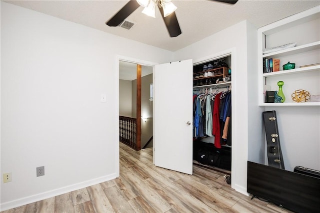3346 Samoa Dr, Corpus Christi, TX 78418 - unfurnished bedroom featuring wood finished floors, a closet, and ceiling fan