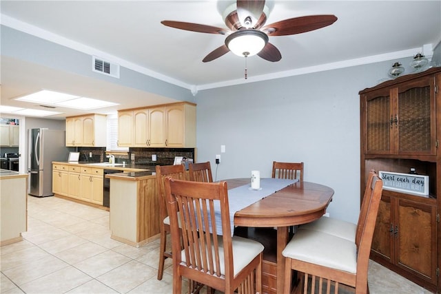 3346 Samoa Dr, Corpus Christi, TX 78418 - dining space featuring light tile patterned flooring, ceiling fan, and crown molding