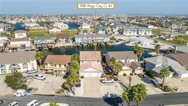 bird's eye view featuring a water view and a residential view