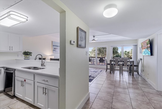 kitchen with dishwasher, white cabinetry, sink, and ceiling fan