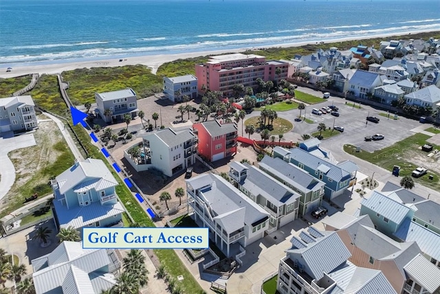 aerial view featuring a view of the beach and a water view