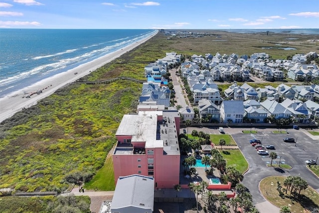 bird's eye view featuring a view of the beach and a water view