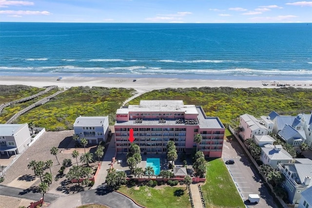 drone / aerial view featuring a view of the beach and a water view