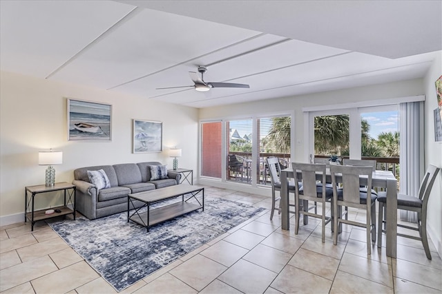 living room featuring light tile patterned flooring and ceiling fan