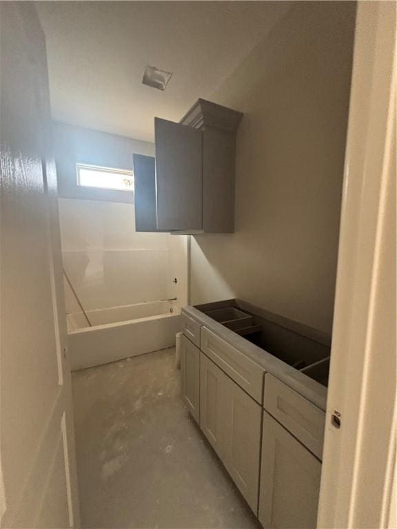 3102 Adak Ct, Corpus Christi, TX 78414 - bathroom featuring unfinished concrete flooring and a tub to relax in