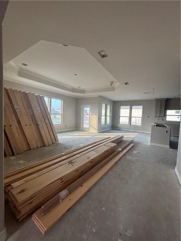 3102 Adak Ct, Corpus Christi, TX 78414 - interior space featuring a raised ceiling, concrete floors, and baseboards