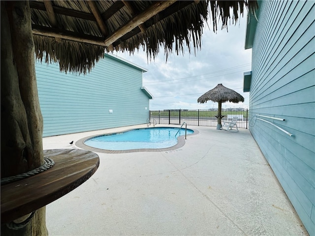 view of swimming pool featuring a patio area