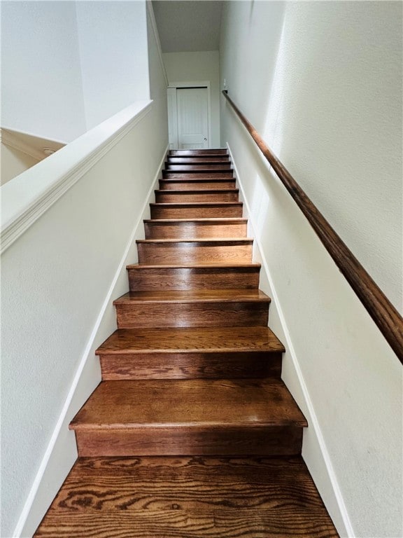 stairs with wood-type flooring