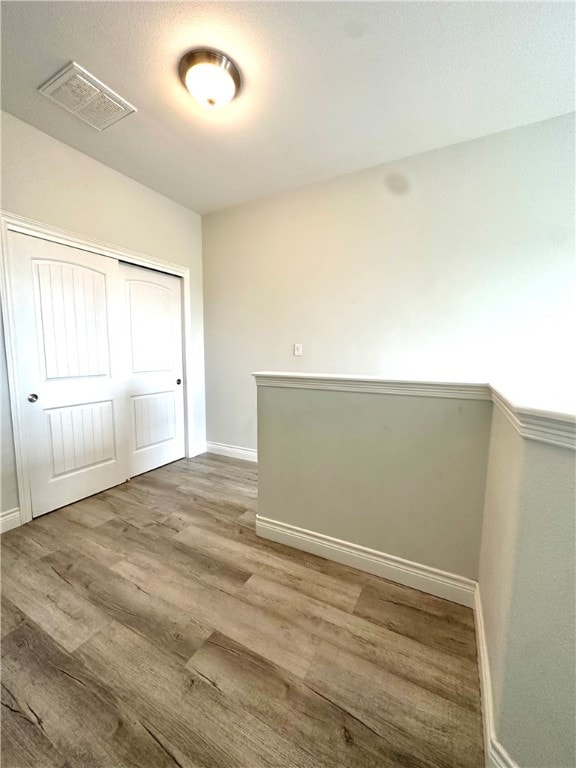 empty room featuring hardwood / wood-style floors