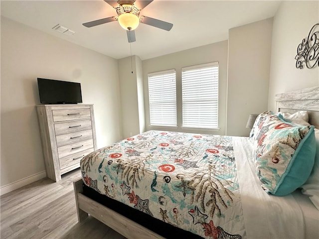 bedroom featuring light hardwood / wood-style floors and ceiling fan