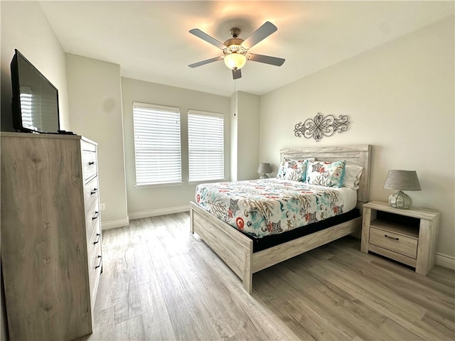 bedroom featuring hardwood / wood-style flooring and ceiling fan