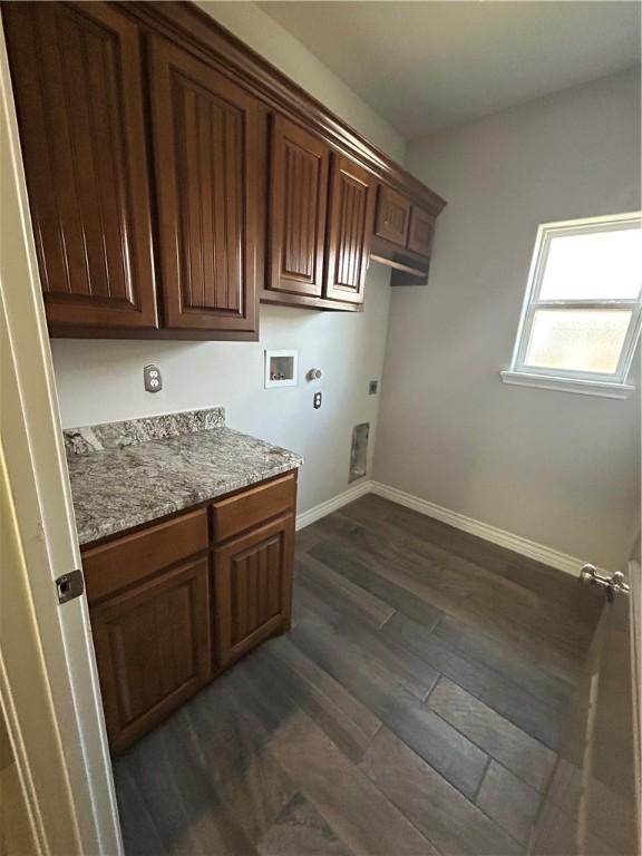119 Moss, Odem, TX 78370 - laundry room featuring cabinet space, hookup for a washing machine, electric dryer hookup, baseboards, and dark wood-style floors