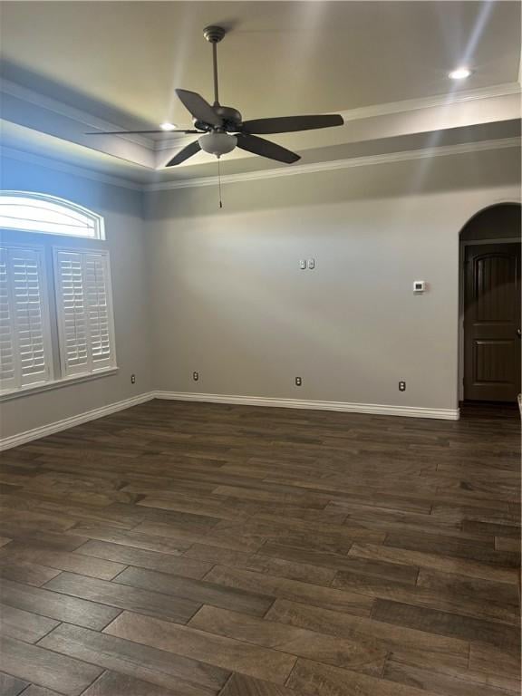 119 Moss, Odem, TX 78370 - unfurnished room featuring crown molding, a ceiling fan, arched walkways, dark wood-style floors, and baseboards
