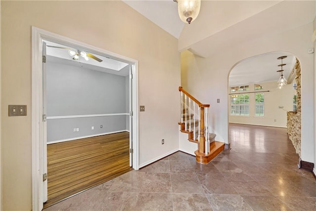 5609 Leicester Dr, Corpus Christi, TX 78414 - entrance foyer featuring stairway, arched walkways, and a ceiling fan