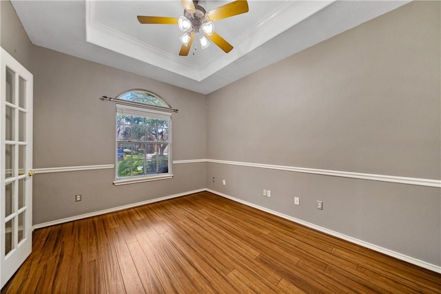 5609 Leicester Dr, Corpus Christi, TX 78414 - unfurnished room featuring a raised ceiling, wood-type flooring, crown molding, and ceiling fan