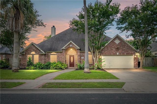 5609 Leicester Dr, Corpus Christi, TX 78414 - view of front of property featuring brick siding, an attached garage, concrete driveway, and a chimney