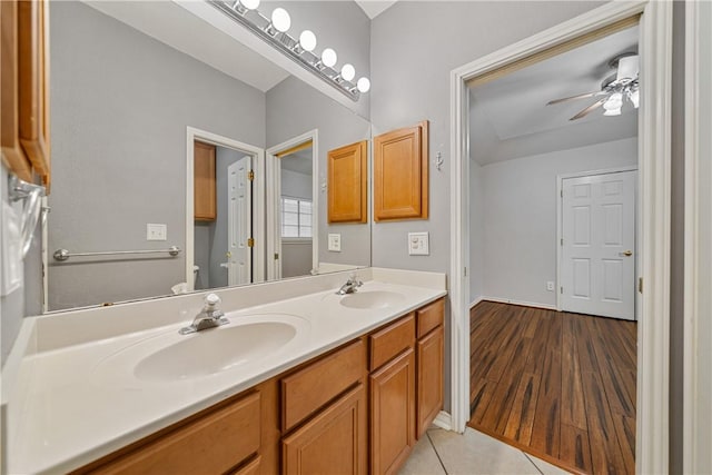 5609 Leicester Dr, Corpus Christi, TX 78414 - full bathroom featuring double vanity, a ceiling fan, and wood finished floors